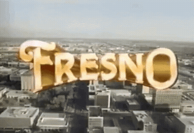Aerial View of City Saying Fresno in Gold Letters