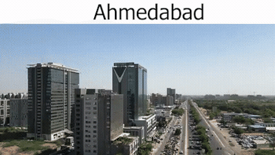 Aerial View Of City With Tall Buildings And Highway GIF