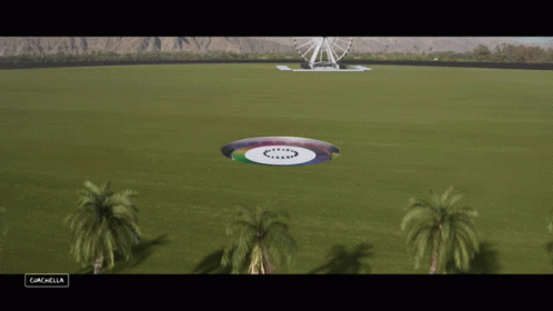 Aerial View Of Field With Ferris Wheel Coachella Sign GIF