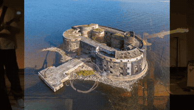 Aerial View Of Large Building In Ocean GIF