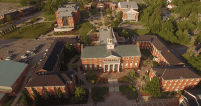 Aerial View Of Large Building With Clock Tower GIF