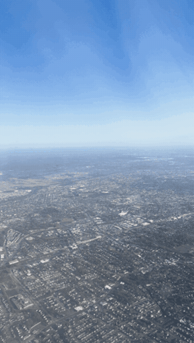 Aerial View Of Large City With Blue Sky GIF