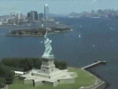 Aerial View Of Statue Of Liberty With City Background GIF