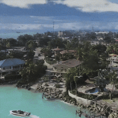 Aerial View Of Tropical Island With Boat GIF