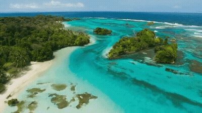 Aerial View Of Tropical Island With White Sandy Beach GIF