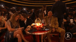 Affleck And Rock Sitting Beside Couples GIF