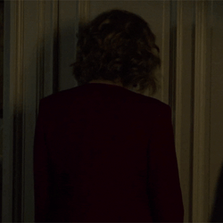Agitated Lady Bangs Head Against Wall GIF
