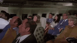 Airplane Movie Dragging A Body GIF
