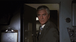Airplane Movie Leslie Nielsen GIF