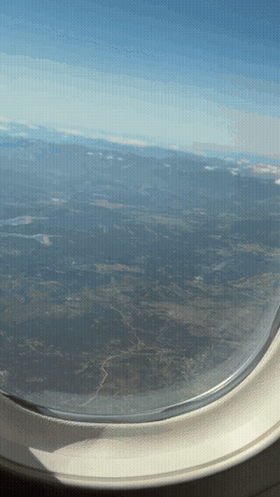 Airplane Window View Of Landscape GIF