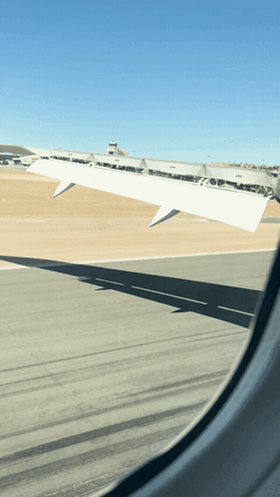Airplane Wing Visible Through Window GIF