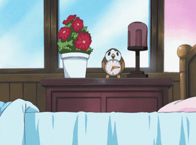Alarm Clock On Nightstand Next To Plant GIF