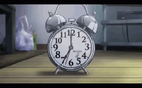 Alarm Clock On Wooden Floor GIF