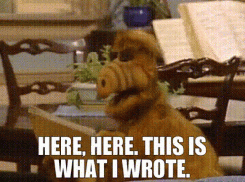 Alf From The Sitcom Alf Says " Here Here This Is What I Wrote " While Reading A Book GIF