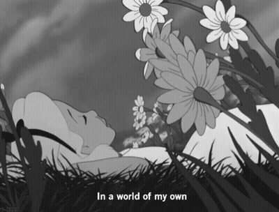 Alice In Wonderland Lying In Grass GIF
