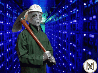 Alien In Hard Hat Holding Pickaxe In Front Of Servers GIF
