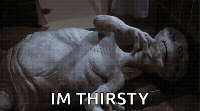 Alien Laying On Floor Saying Im Thirsty GIF