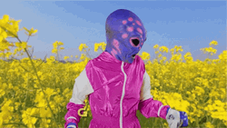 Alien Mascot Sneeze During Spring GIF