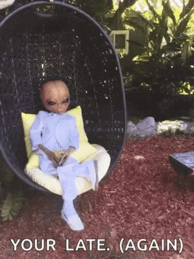 Alien Sitting In Chair Your Late Again GIF