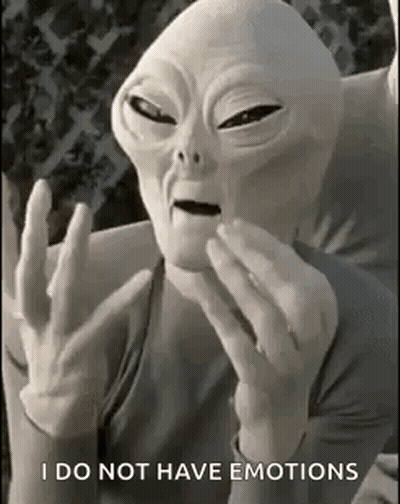 Alien Sitting On Couch Making Funny Face GIF