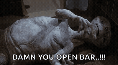 Alien Statue Laying On Floor Saying Damn You Open Bar GIF