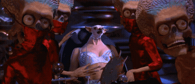 Aliens Standing Around Woman GIF