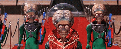 Aliens Standing On Red Carpet With Guns GIF