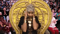 Amanda Seales Ear Plugs With Gold Bracelet GIF