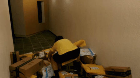 Amazon Boxes Scattered On Floor GIF