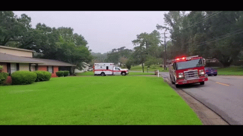 Ambulance And Fire Truck Parked In Front Of House GIF