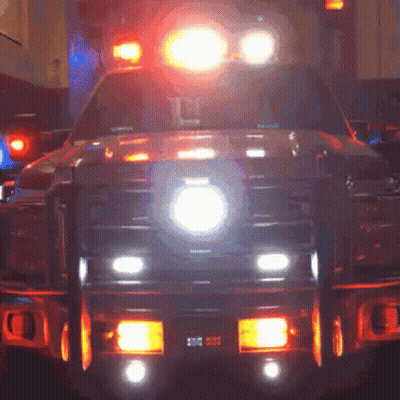 Ambulance Front Lit Up With Number 10 On Bumper GIF