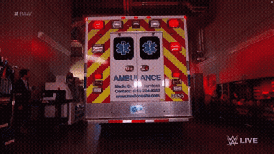 Ambulance Parked In Dark Room With Man In Suit GIF