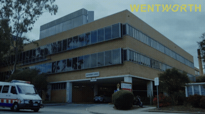 Ambulance Parked In Front Of Wentworth Building GIF