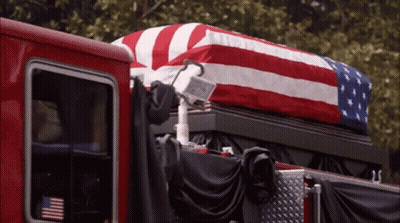American Flag Draped Over Coffin GIF