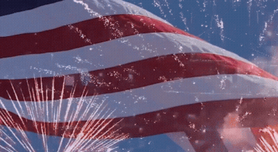 American Flag Flying With Fireworks GIF