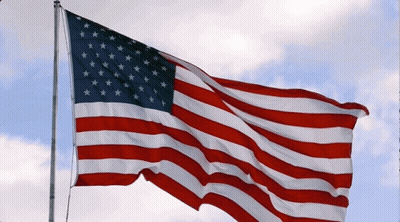 American Flag Waving In Wind With Cloudy Sky GIF
