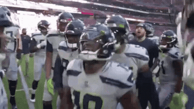 American Football Players Walking Off Field GIF