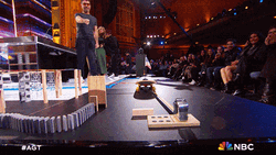 Amusing Huge Park Dominos Falling GIF