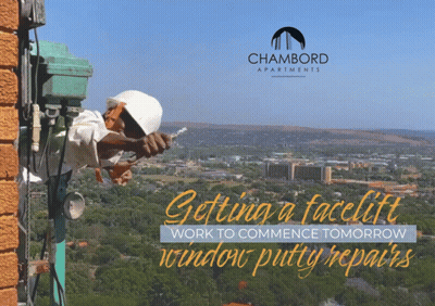 An Ad For Chambord Apartments Shows A Man Working On A Brick Wall GIF