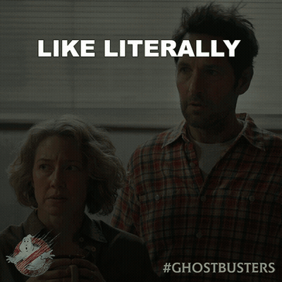 An Ad For Ghostbusters Shows A Man And A Woman Looking At Something GIF