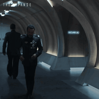 An Ad For The Expanse Shows A Man And A Woman GIF
