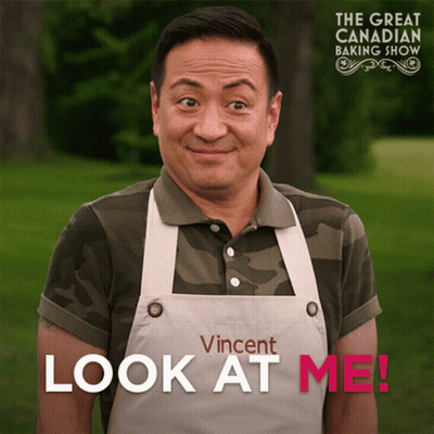 An Ad For The Great Canadian Baking Show Shows A Man Wearing An Apron GIF