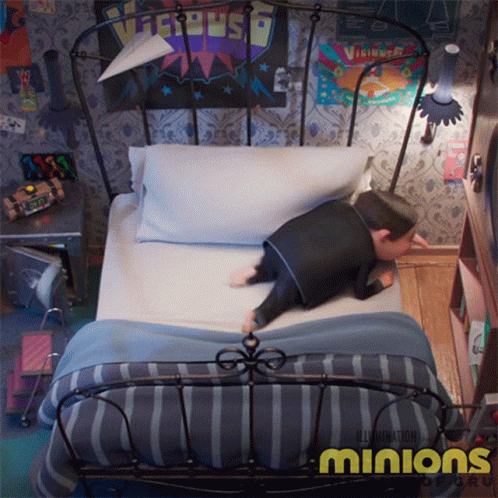 An Ad For The Movie Minions Shows A Man Laying On A Bed GIF