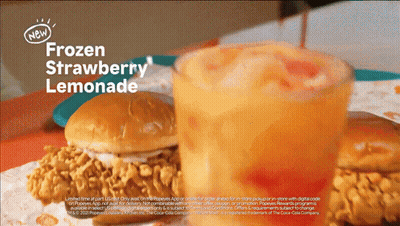 An Advertisement For Frozen Strawberry Lemonade Shows A Chicken Sandwich And A Glass Of Lemonade GIF