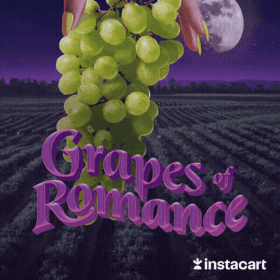 An Advertisement For Grapes Of Romance Shows A Bunch Of Grapes GIF