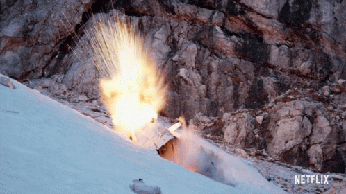 An Advertisement For Netflix Shows An Explosion On A Snowy Mountain GIF