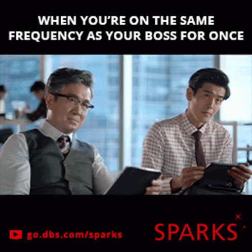 An Advertisement For Sparks Shows Two Men Looking At Their Phones GIF