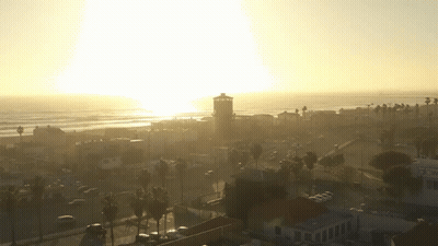 An Aerial View Of A Beach With A Cnn Sign In The Foreground GIF