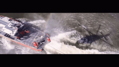 An Aerial View Of A Boat Going Through A Body Of Water GIF