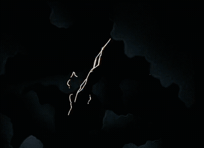 An Aerial View Of A Building With A Few Windows Lit Up At Night GIF